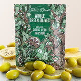 Close up of Teta's Olives Whole Green Olive Snacks, Citrus Herb Infusion flavor with olives and lemon slices surrounding the bag