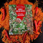 image of a bag of teta's olives fiery hot thai pepper laying on a bed of crushed red peppers, surrounded by red thai peppers