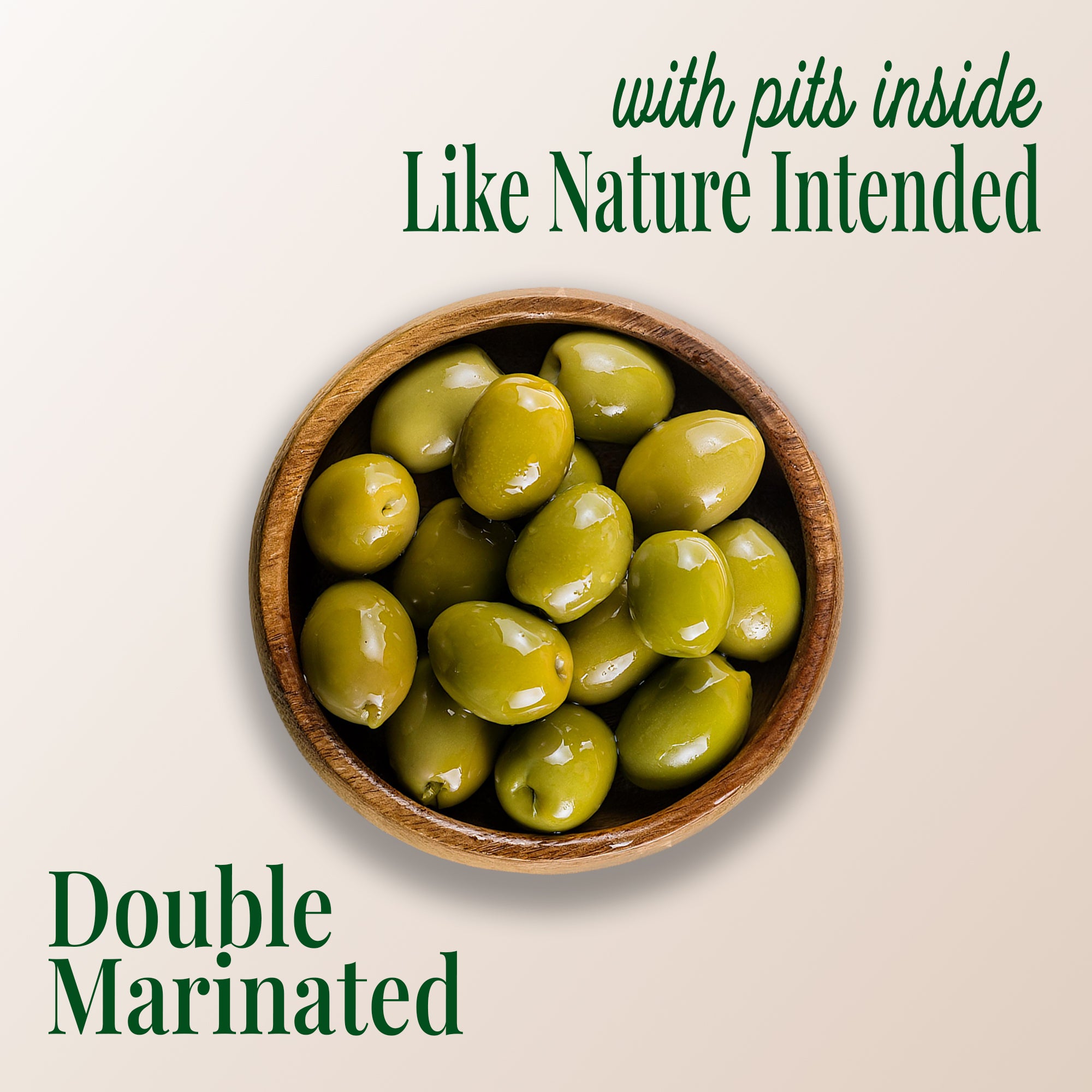 image of a plate of whole green olives, with text saying "with pits inside like nature intended" and "double marinated" with teta's olives logo