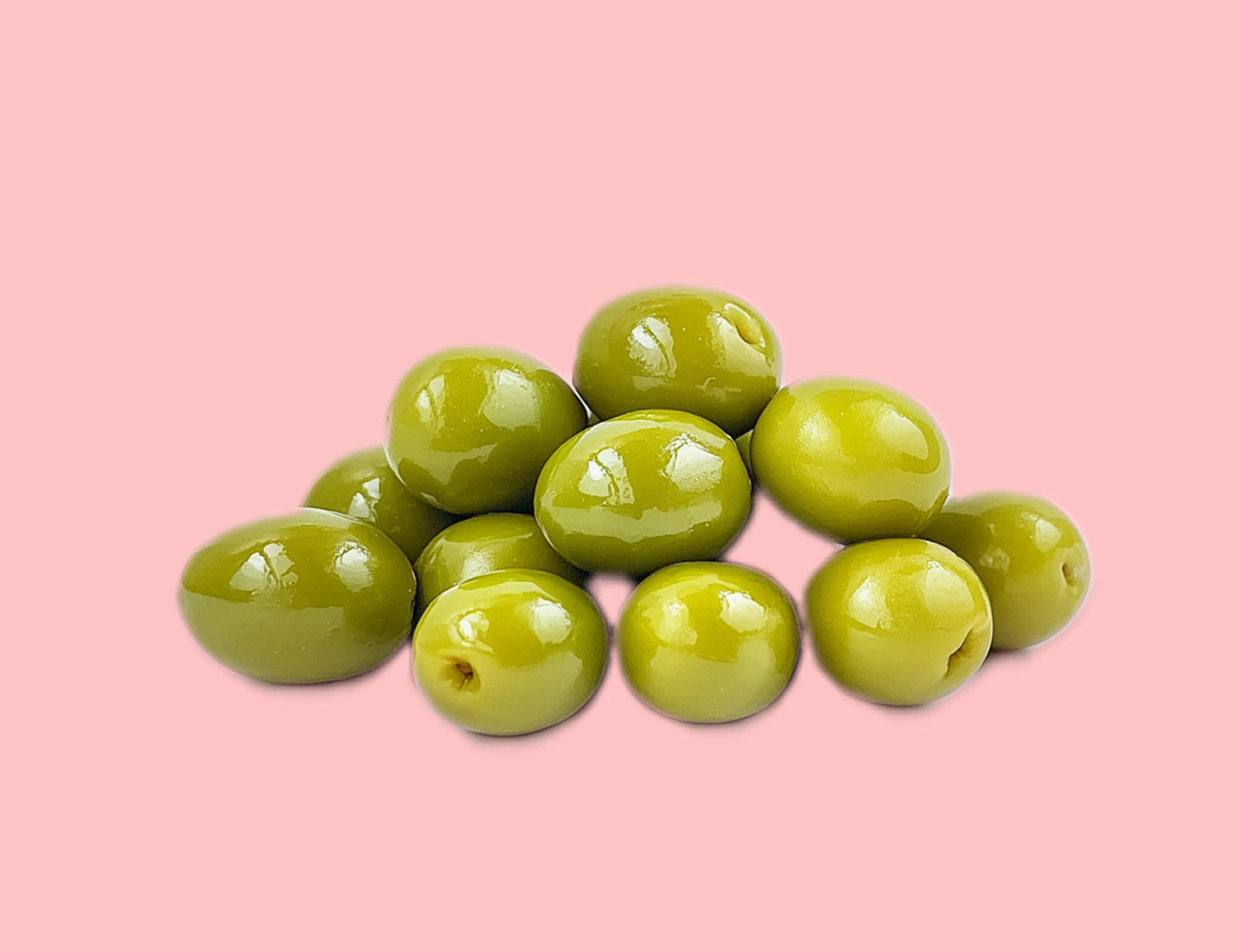 close-up image of teta's olives whole green nabali olives, against a light red background