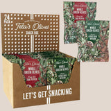 24 pack variety snack box of teta's olives classic citrus herb infusion and fiery hot thai pepper against a light brown background